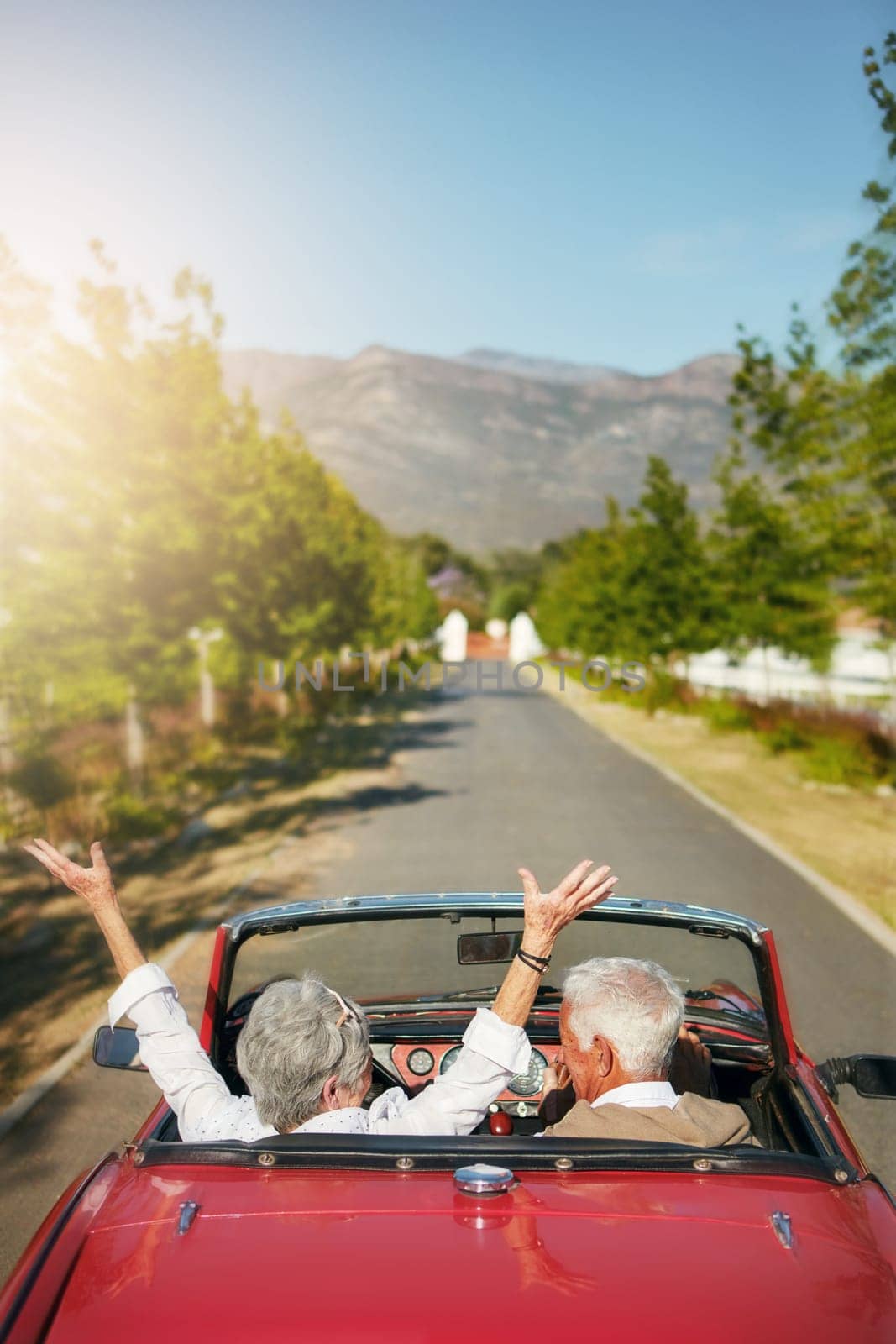 To live is to travel. a senior couple going on a road trip. by YuriArcurs