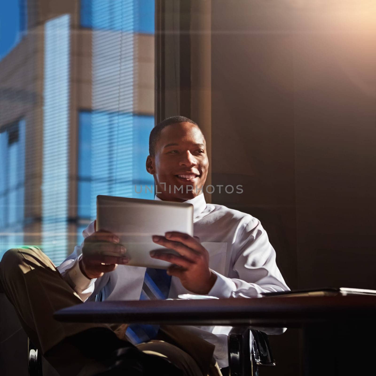 This is my go-to technology tool. a young man contemplating while using his digital tablet