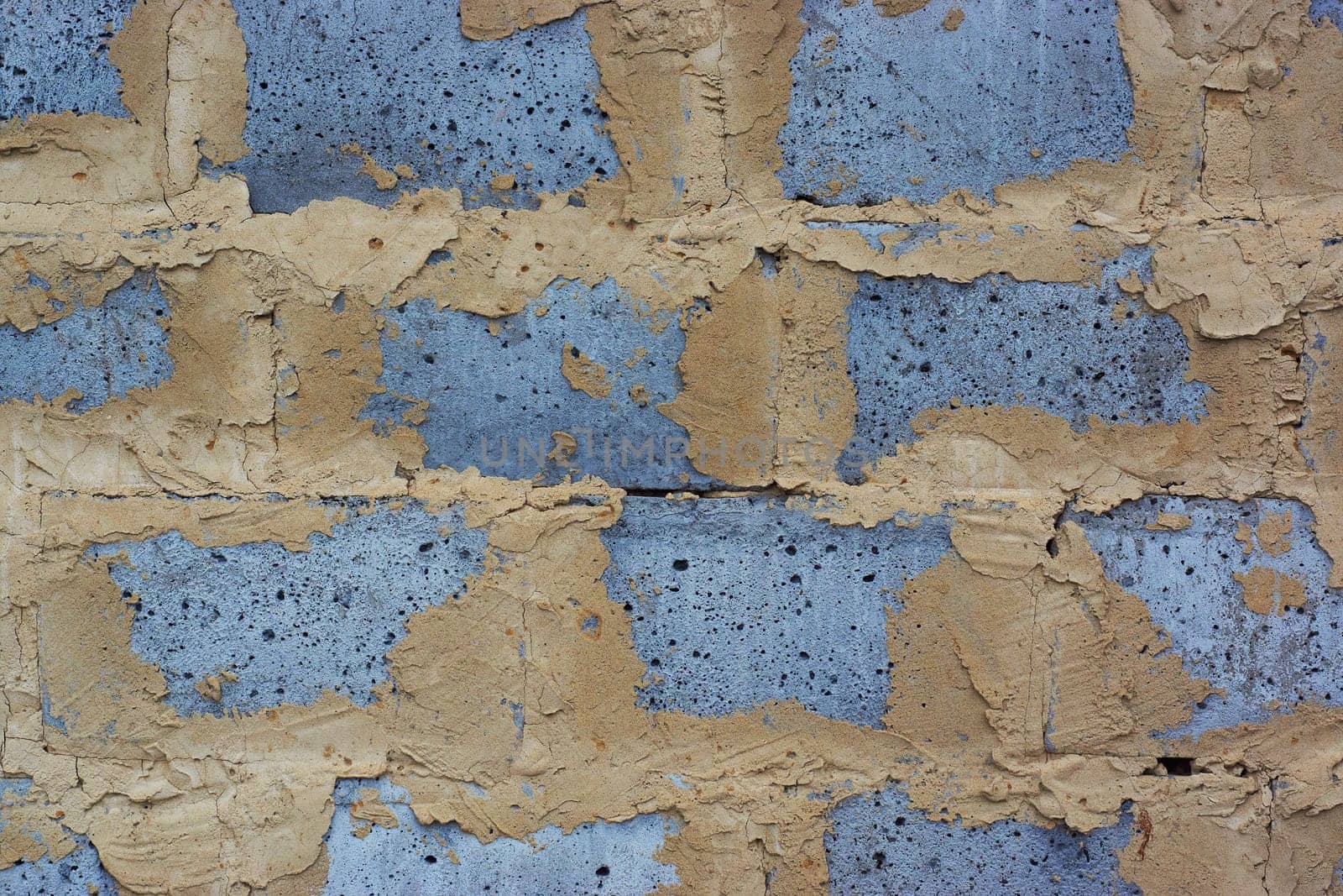 textured pattern on a concrete wall close-up. grey mortar seam. rough texture of clay. the current communication pattern. the concept of the construction industry and architecture. background image.