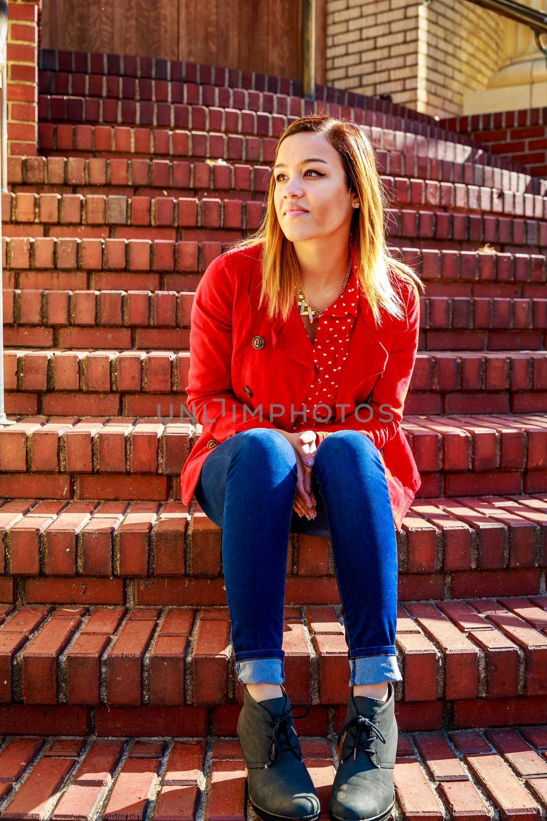 Young female college student relax on campus.