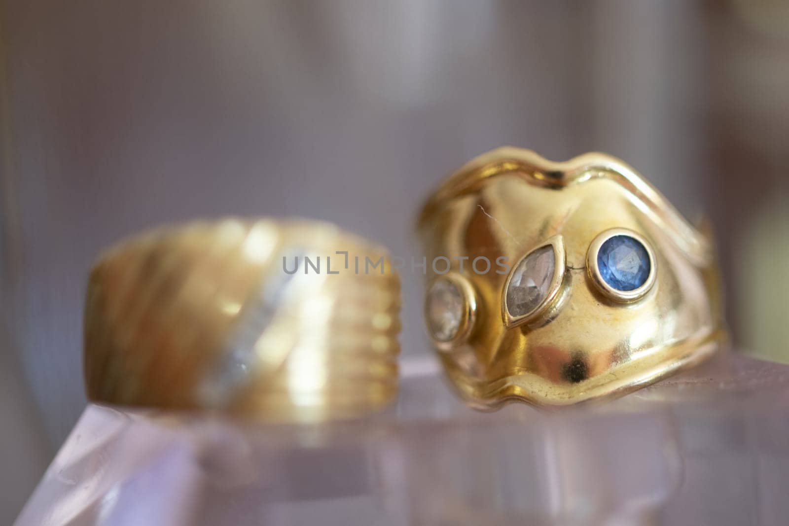 gold ring with precious stones view through glasses