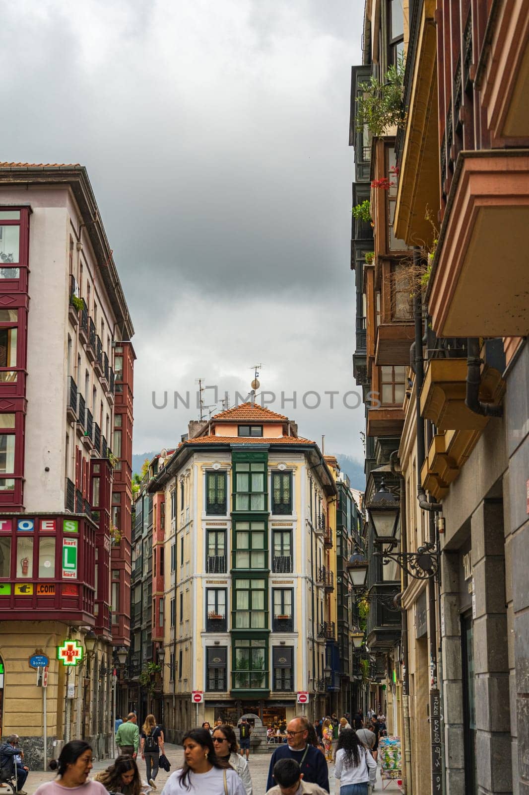 Bilbao, Basque Country, Spain - 10.06.2022: People stroll through the narrow streets of Bilbao
