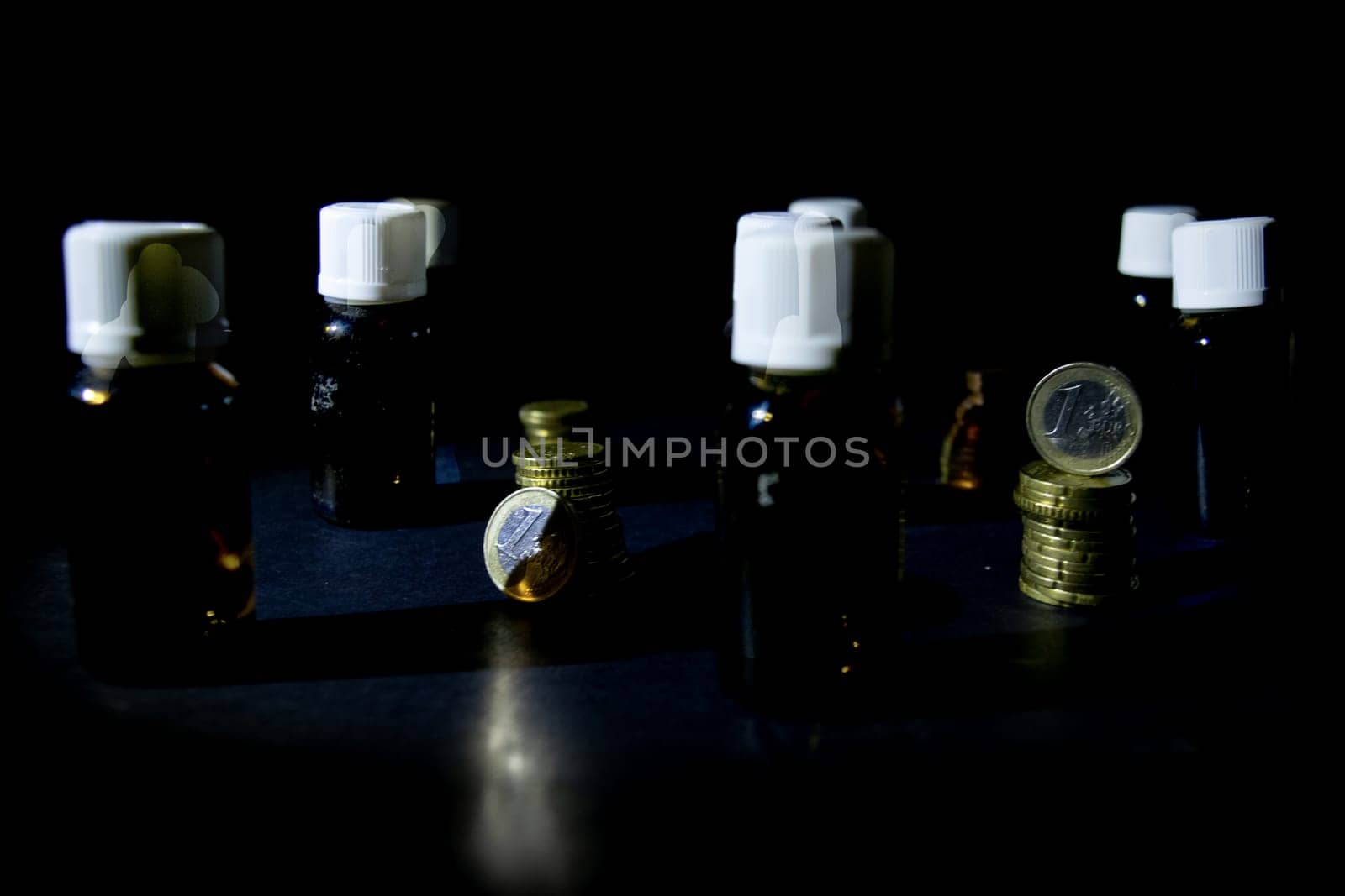 finance and healthcare with coins next to medicine bottles