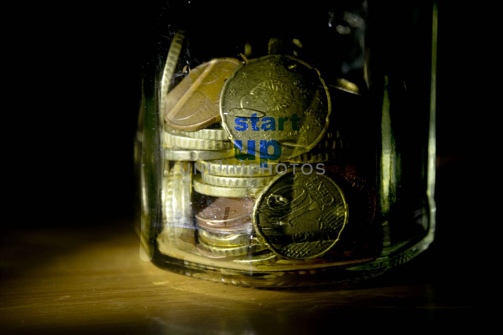 concept of startup with money in a jar