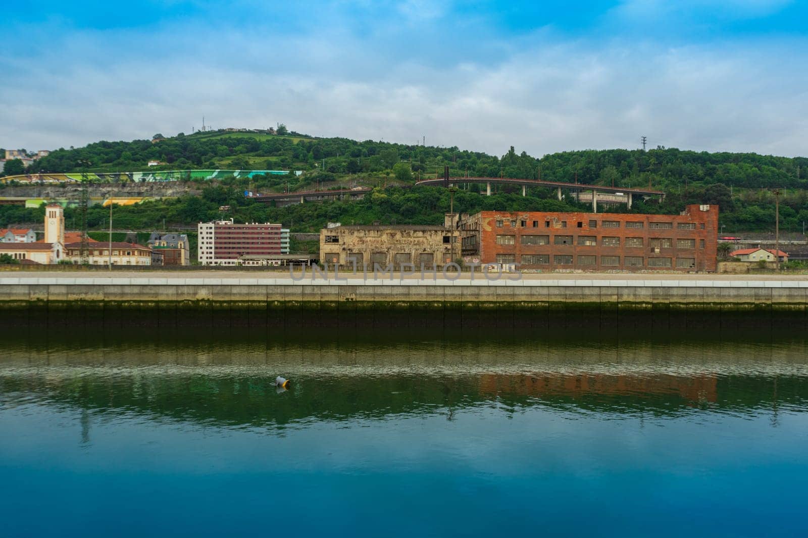 Abandoned industrial buildings along the Nervion River, Bilbao Basque Country, Spain