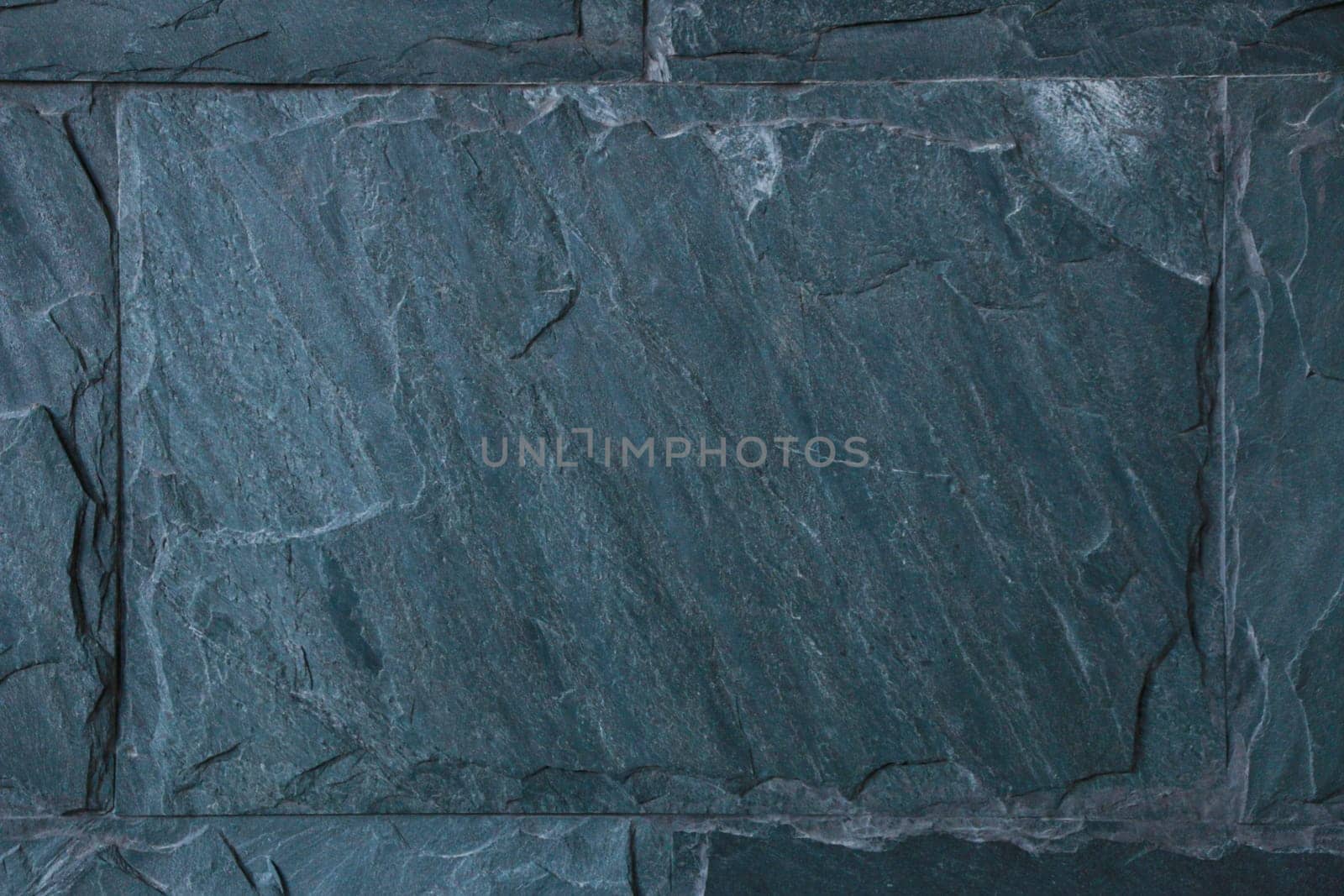 High resolution marble texture background. Texture of a stone wall painted with blue paint.