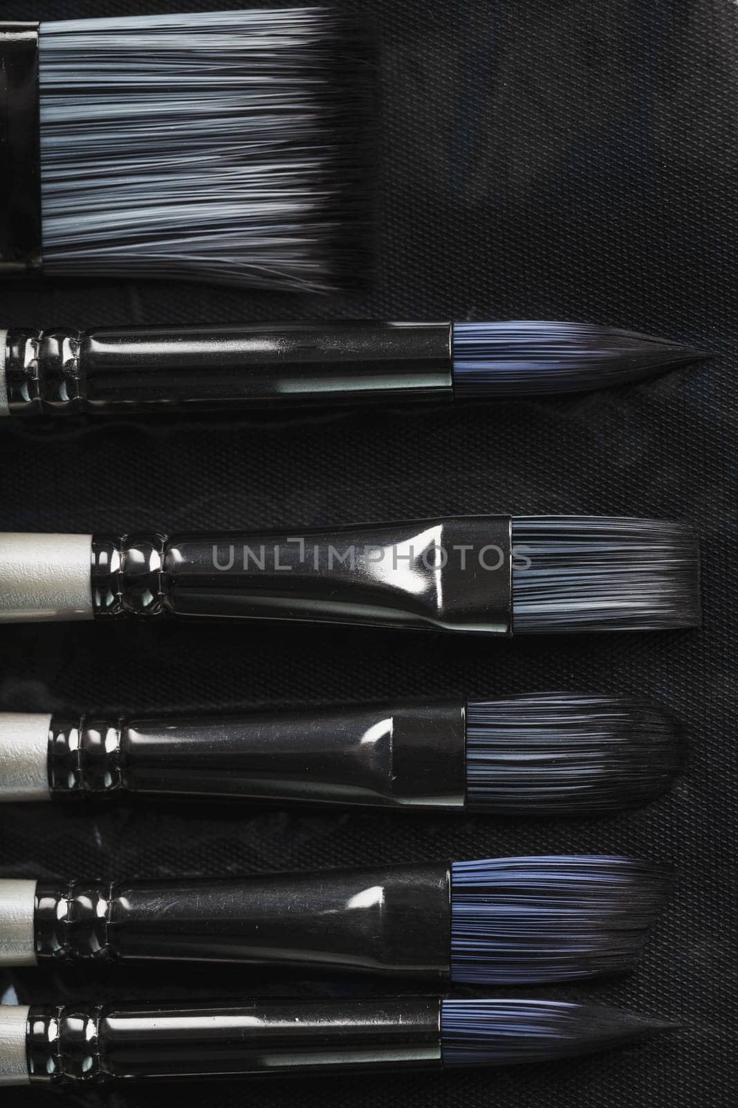 A set of art brushes for drawing on a black background, Close-up