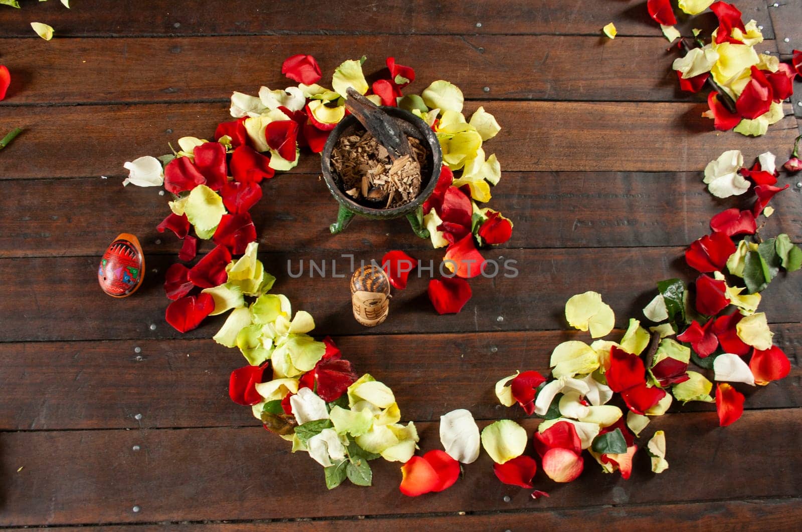 flower arrangement in the form of a spiral of red and yellow colors on the ground to perform an indigenous ritual. High quality photo