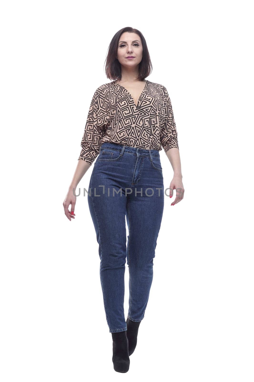 in full growth. an attractive young woman in jeans. isolated on a white background.