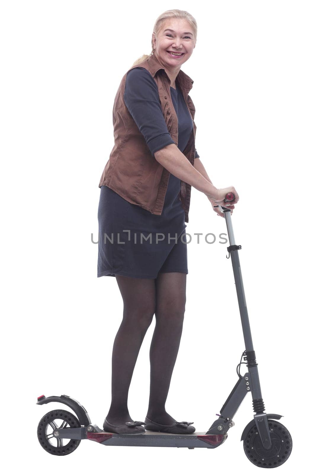 in full growth. happy woman with a comfortable electric scooter. isolated on a white background