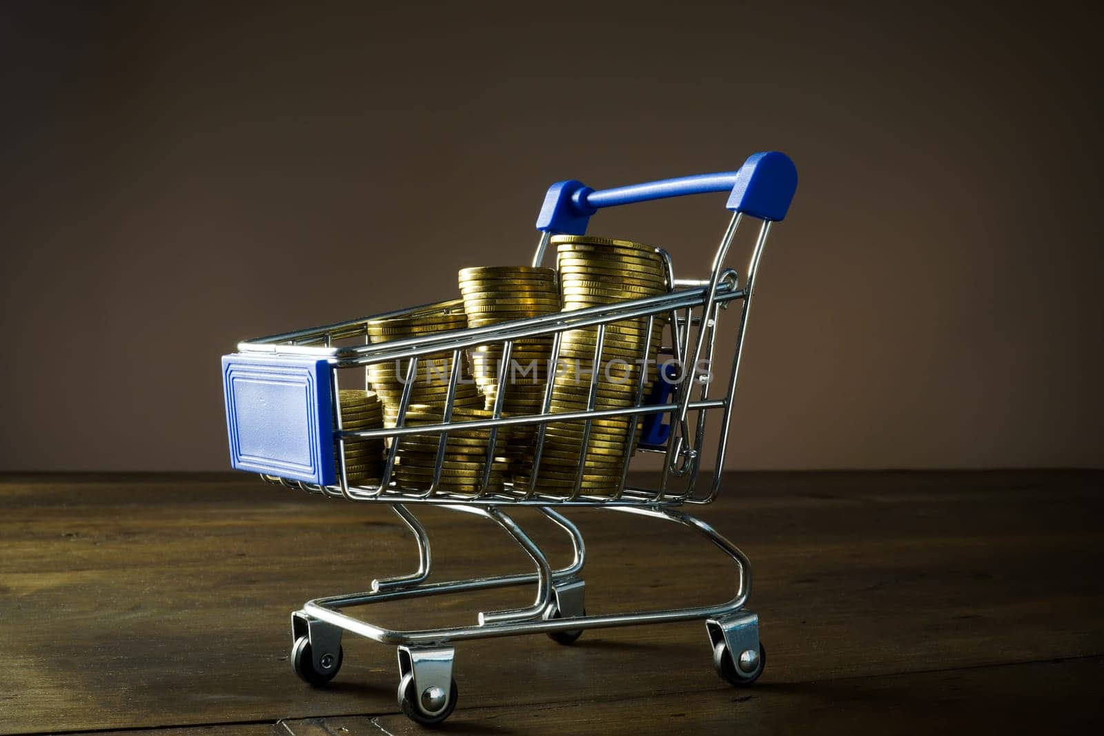 Shopping cart full of coins as a concept payday loan. by designer491