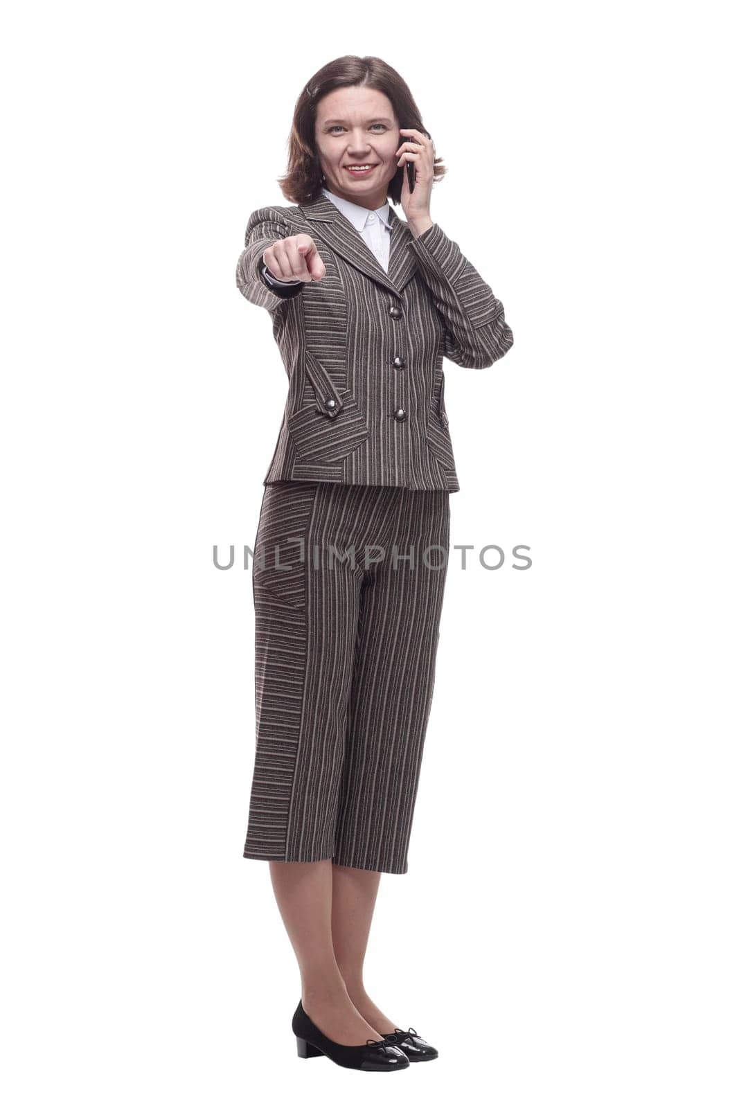 in full growth. modern business woman with a smartphone. isolated on a white background.