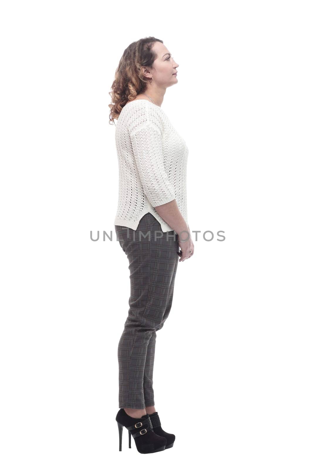 in full growth. attractive young woman in a white jumper. isolated on a white background.