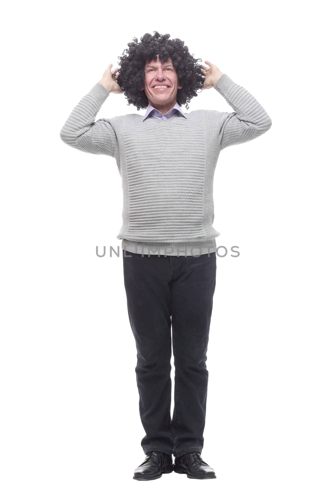 in full growth. amusing a man in a wig. isolated on a white background.