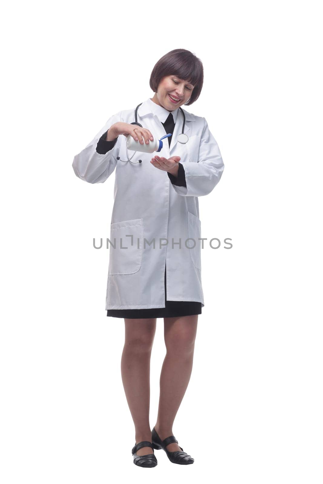 in full growth. female medic using sanitizer . isolated on a white background.