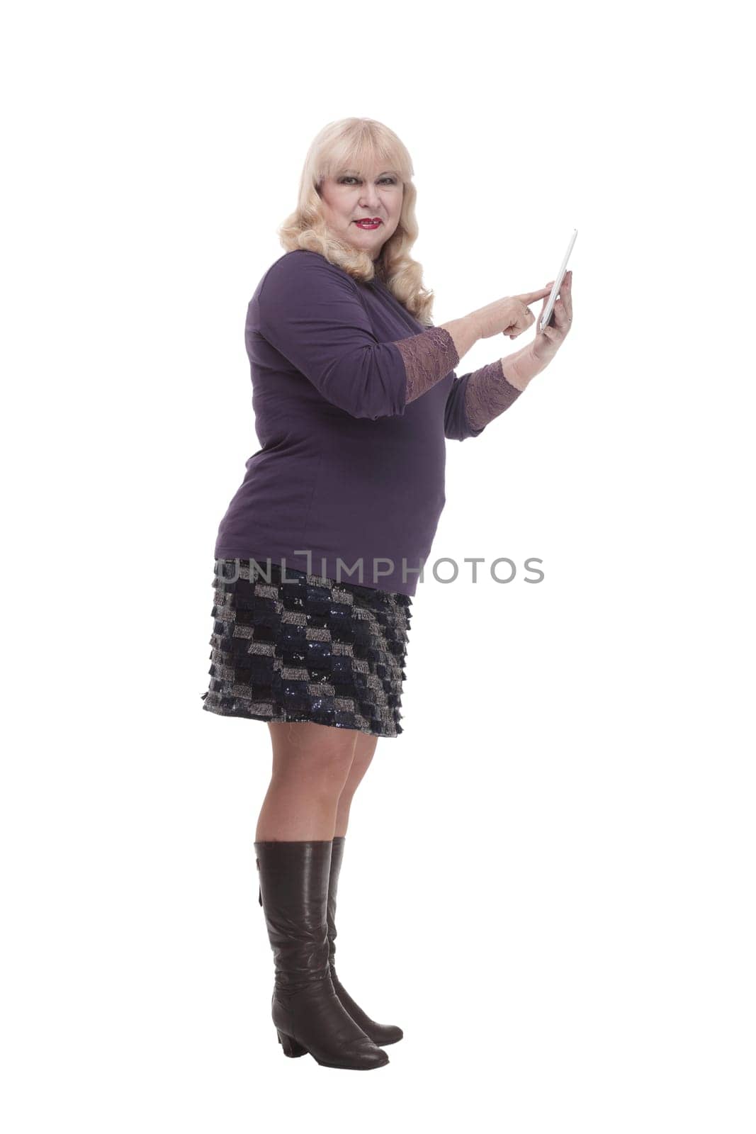 full-length. casual mature woman with a digital tablet . isolated on a white background.