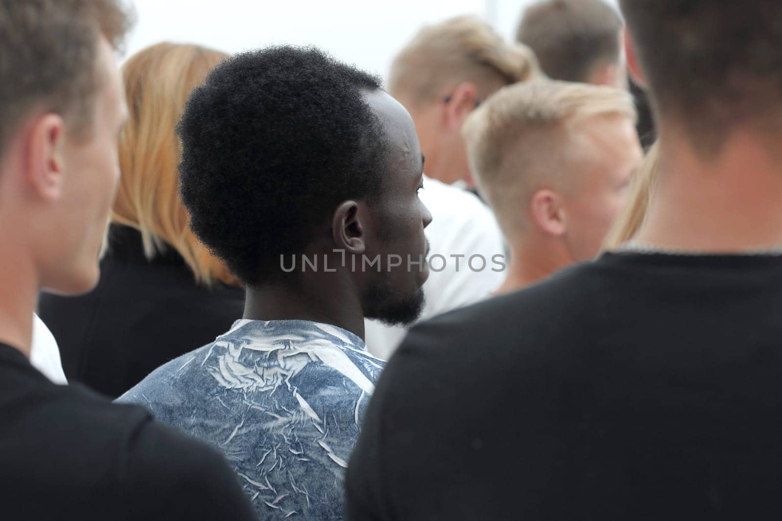 cropped image of a youth group pointing up. by asdf