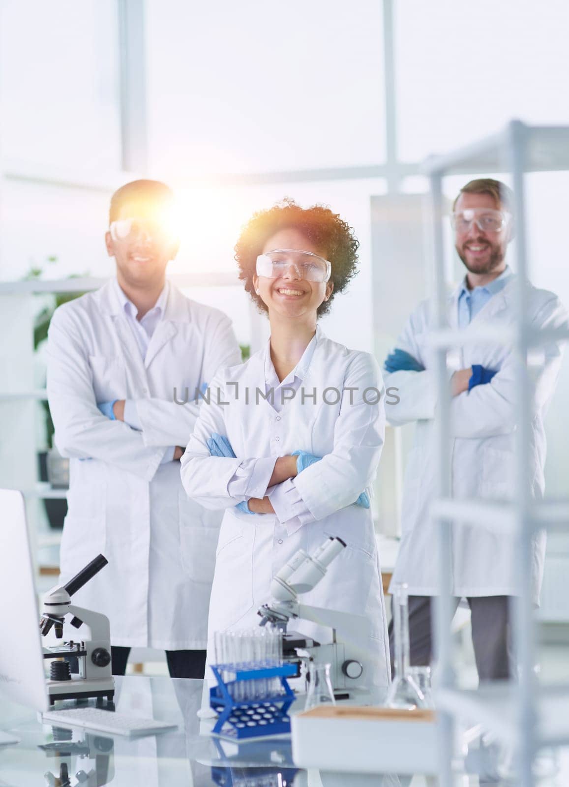 Scientists smiling together in lab