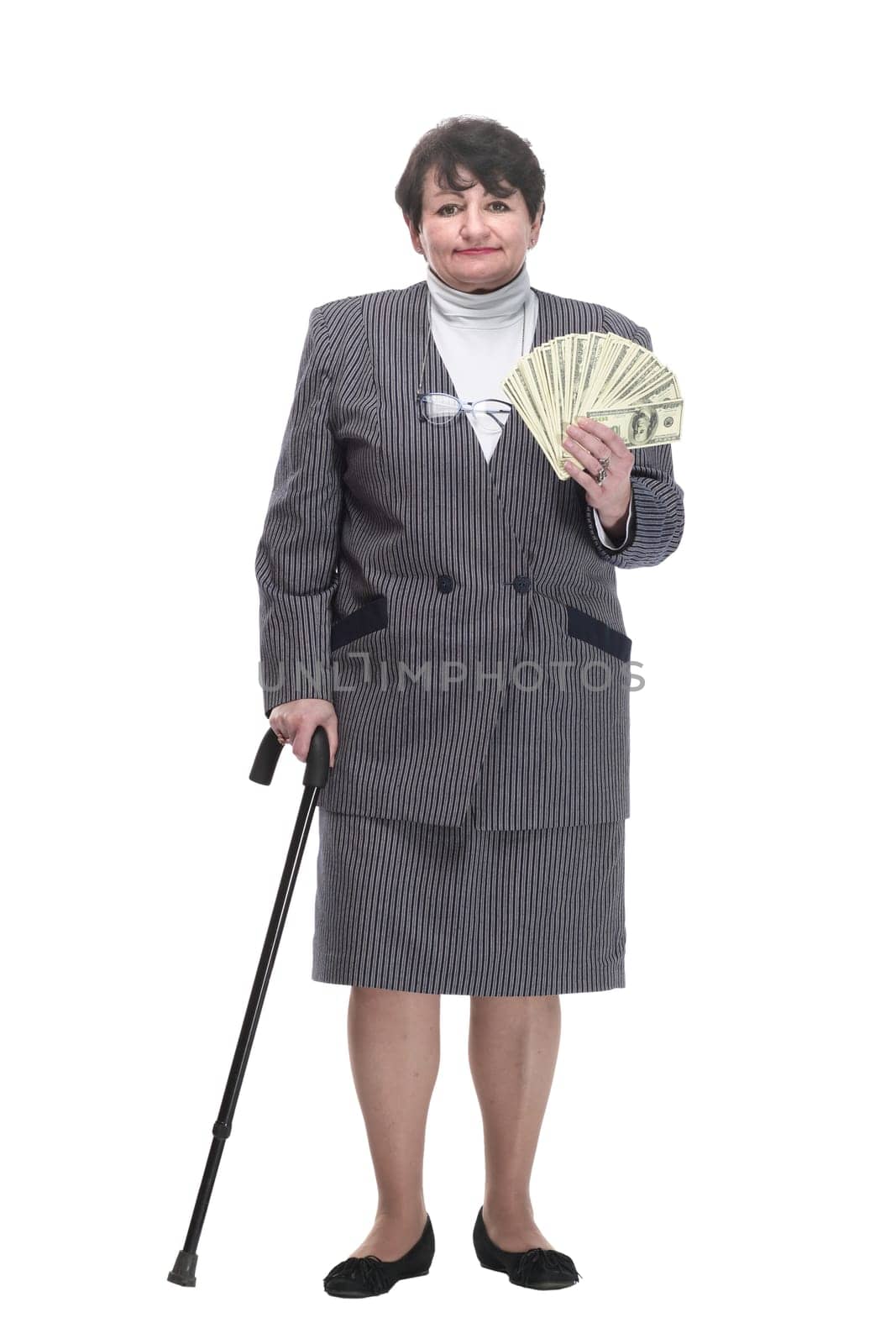 smiling old woman with a fan of banknotes. isolated on a white background.