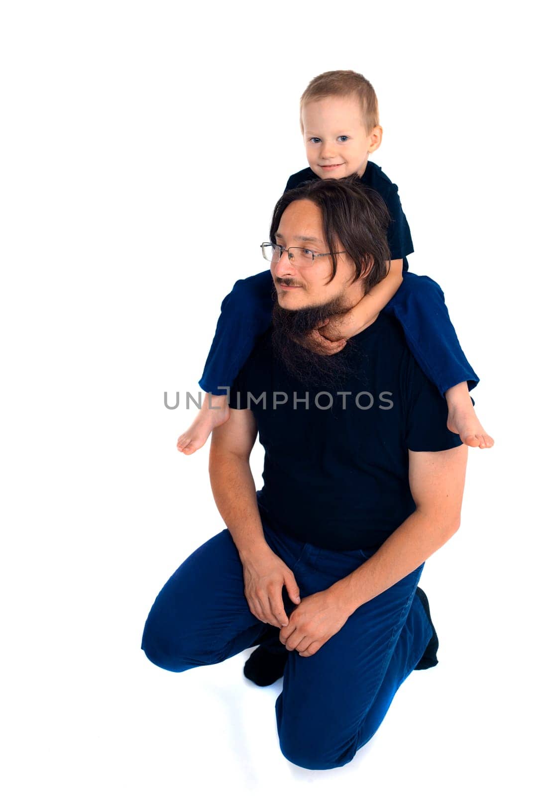 young handsome father with his son fooling around, lifestyle on white background. High quality photo