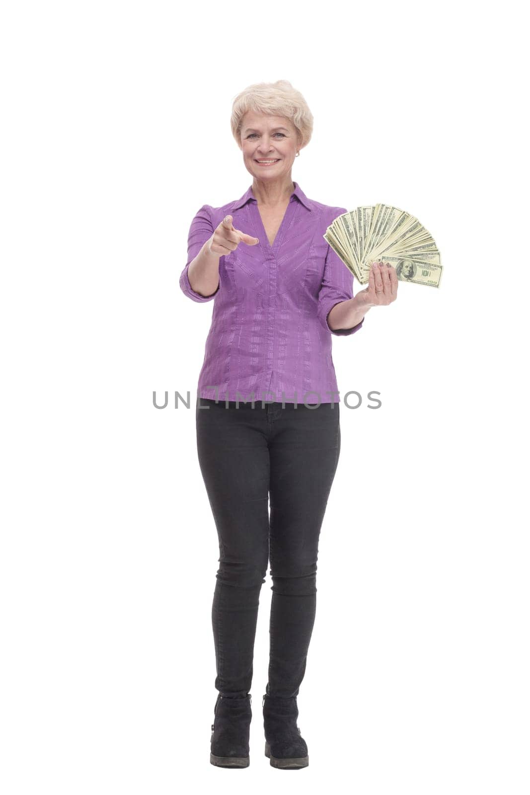 in full growth. happy mature woman with banknotes. isolated on a white background.