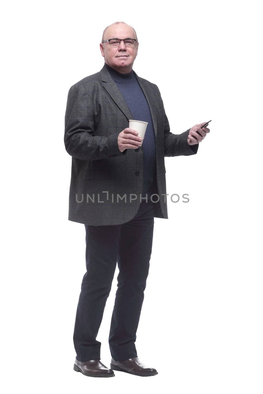 in full growth. c asual b usiness m an w ith c offee t o t ake away . isolated on a white background