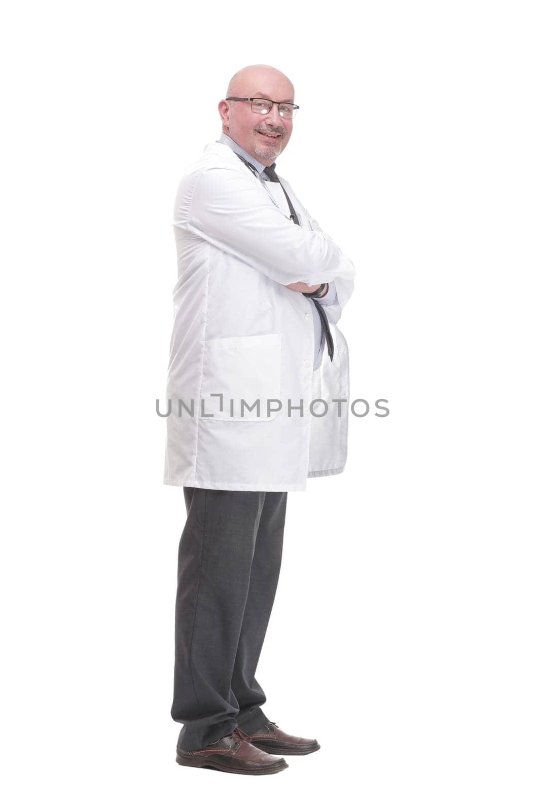 in full growth. successful mature doctor in a white coat .isolated on a white background