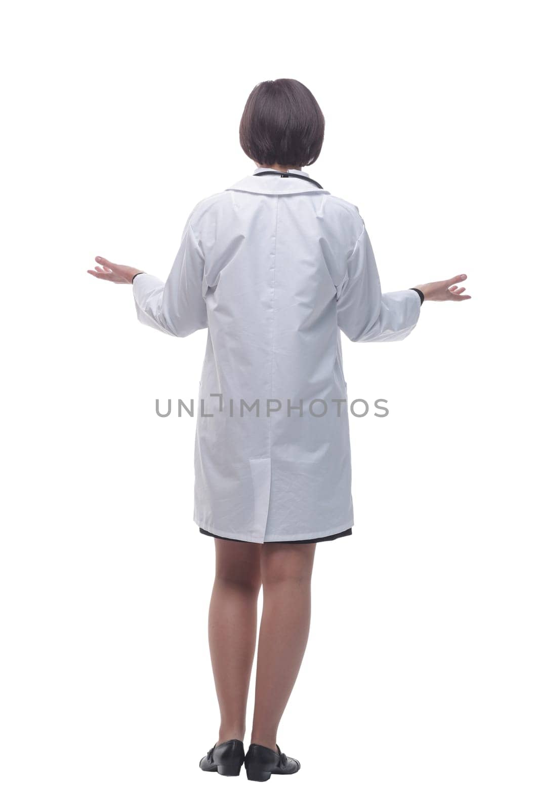 rear view. female doctor looking at a white screen. isolated on a white background.