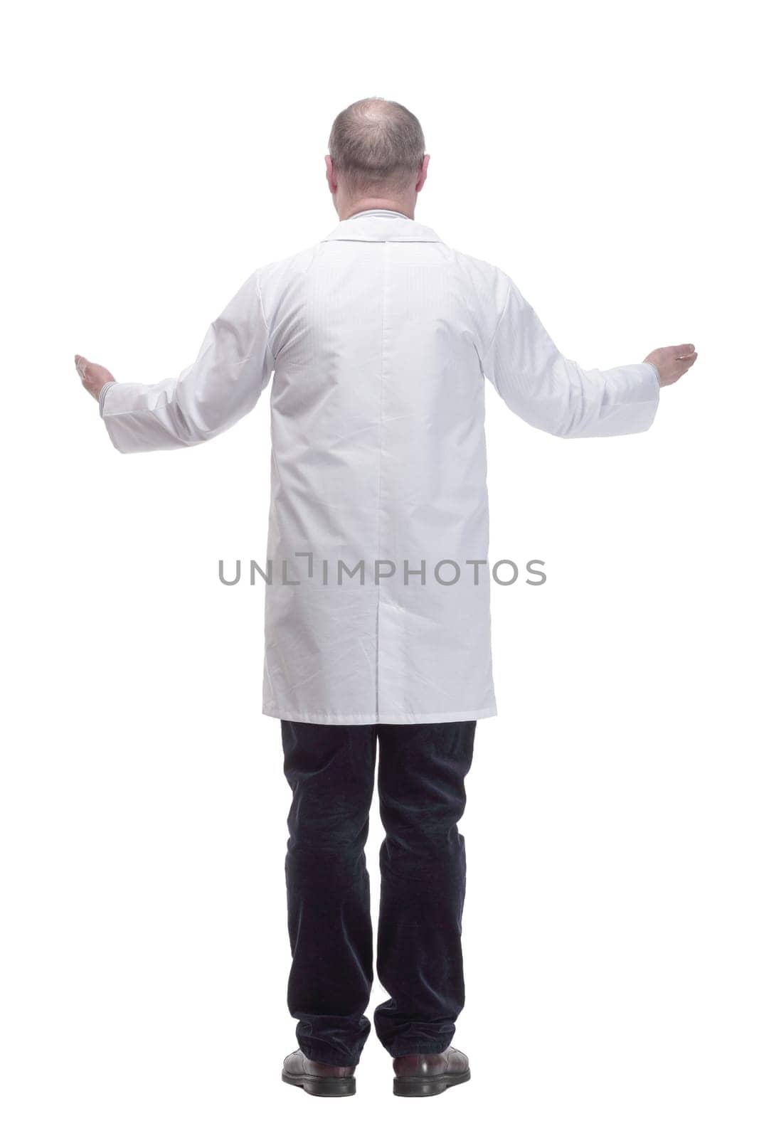 in full growth. qualified mature doctor in a white coat .isolated on a white background.