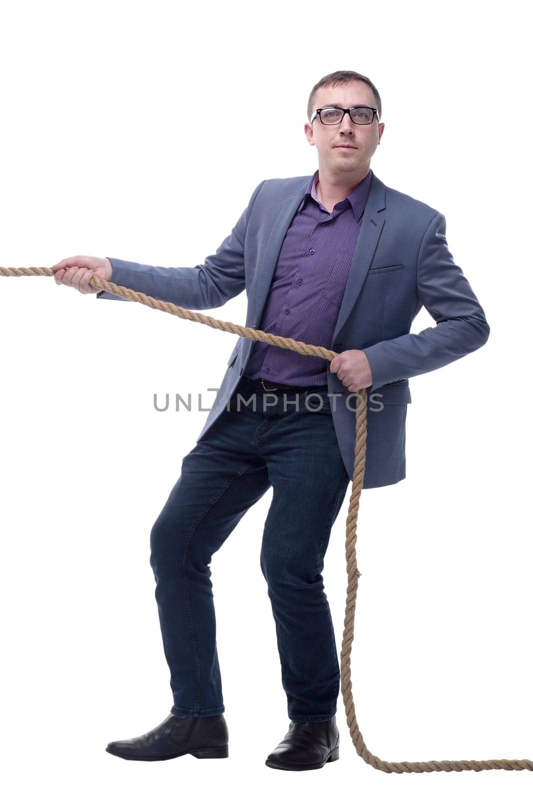 Handsome businessman in glasses pulling a rope isolated on white background