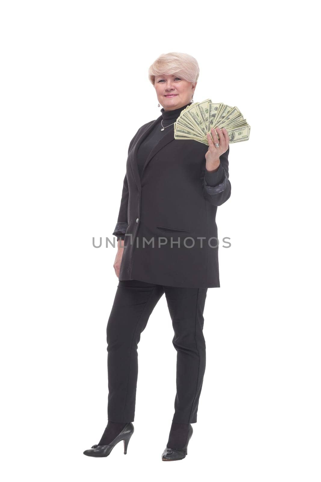 in full growth. happy business woman with banknotes. isolated on a white background.