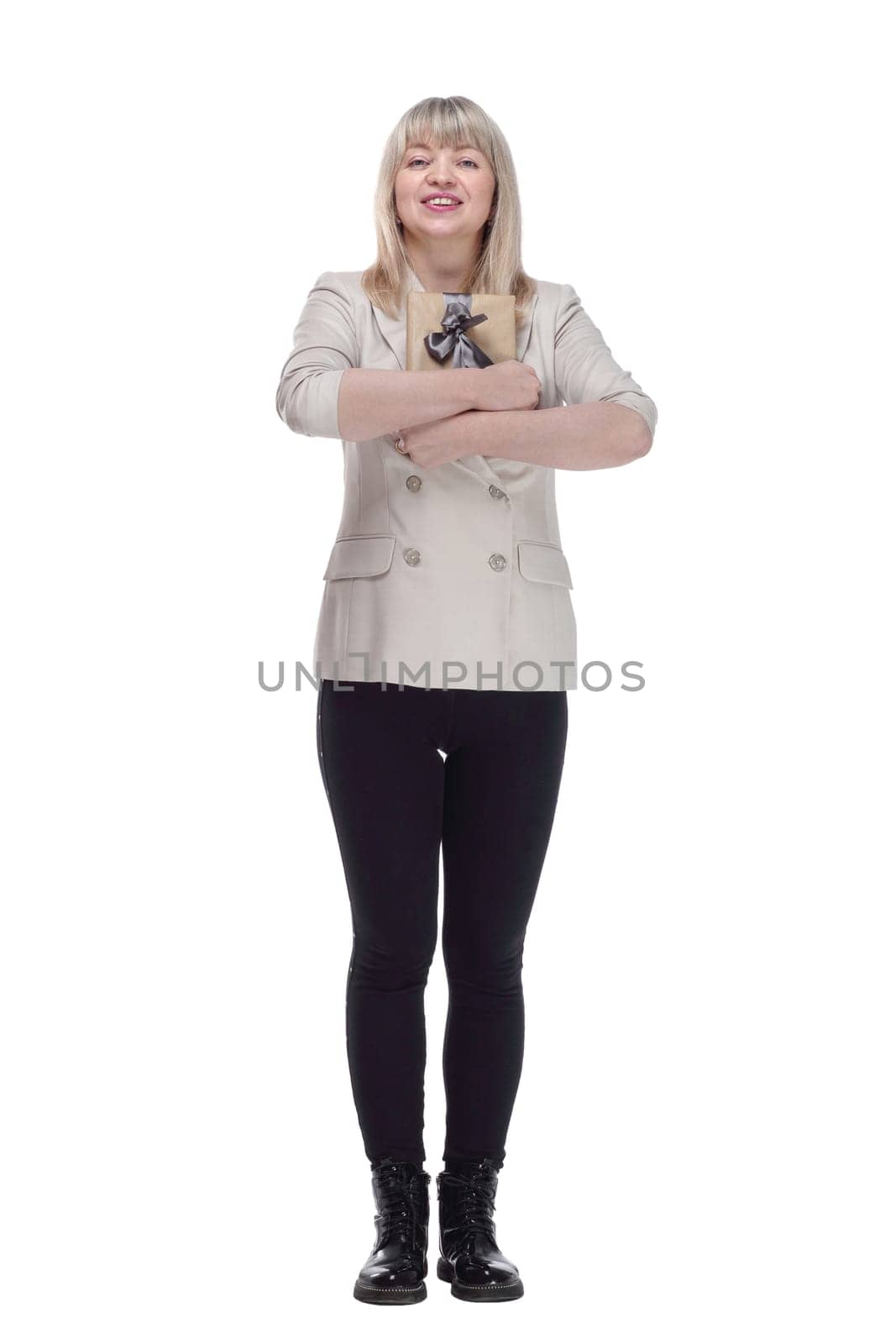 in full growth. attractive adult woman with a gift box in her hands . isolated on a white background.