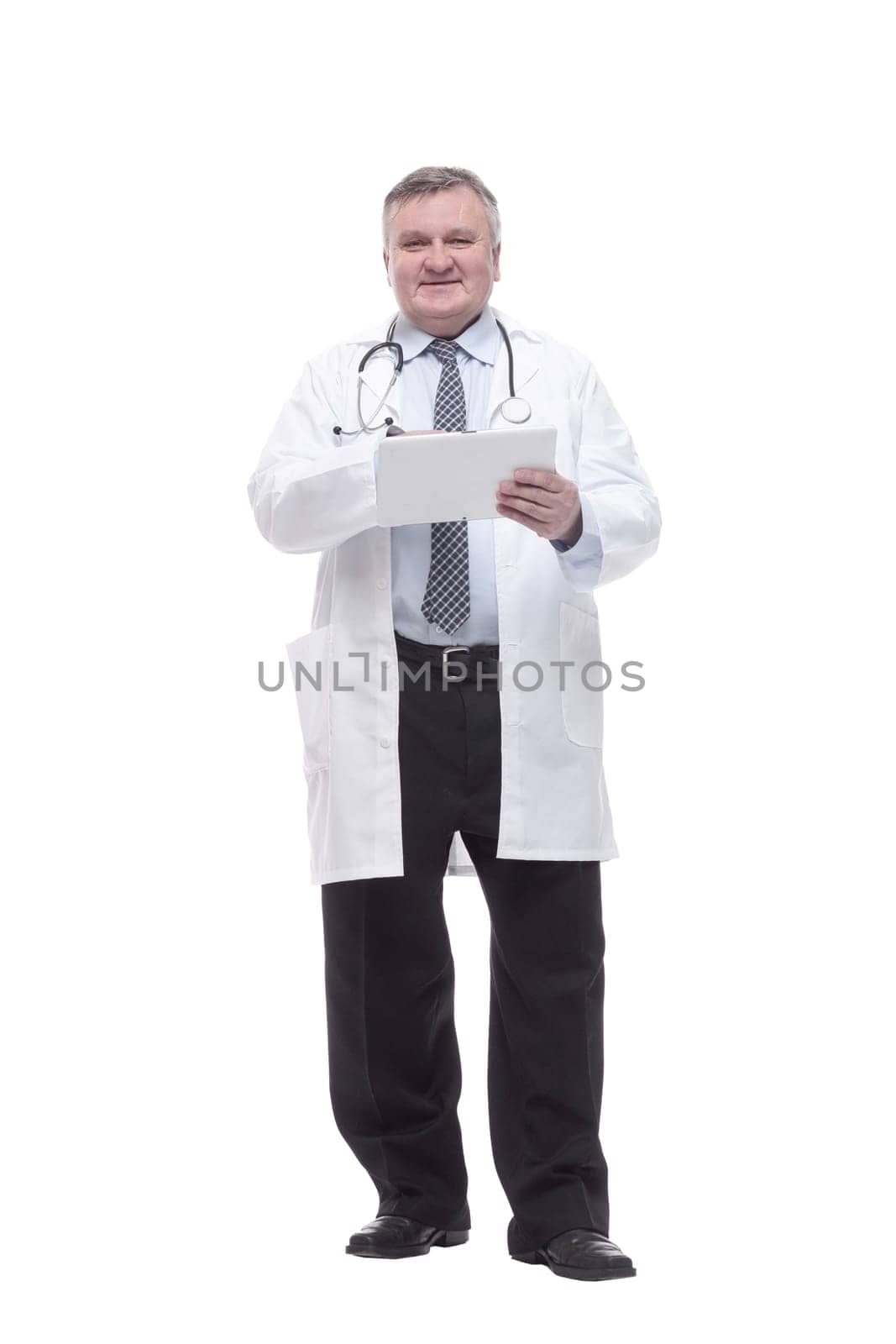 in full growth.competent doctor with clipboard. isolated on a white background.