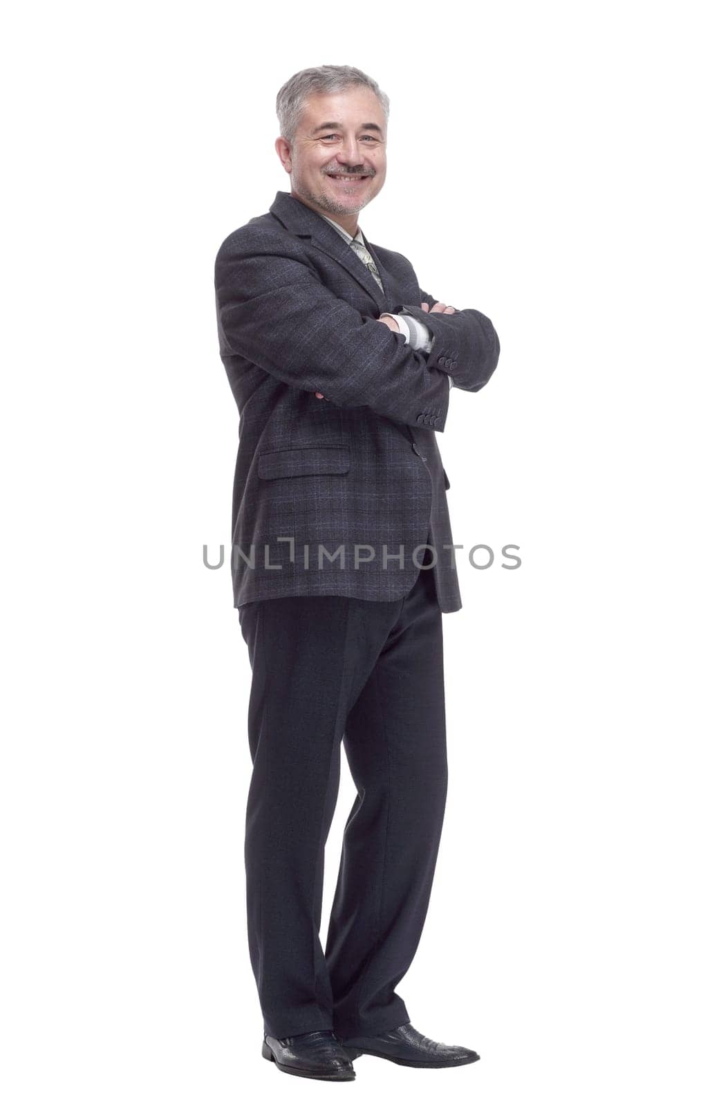 in full growth. happy mature man looking at you . isolated on a white background