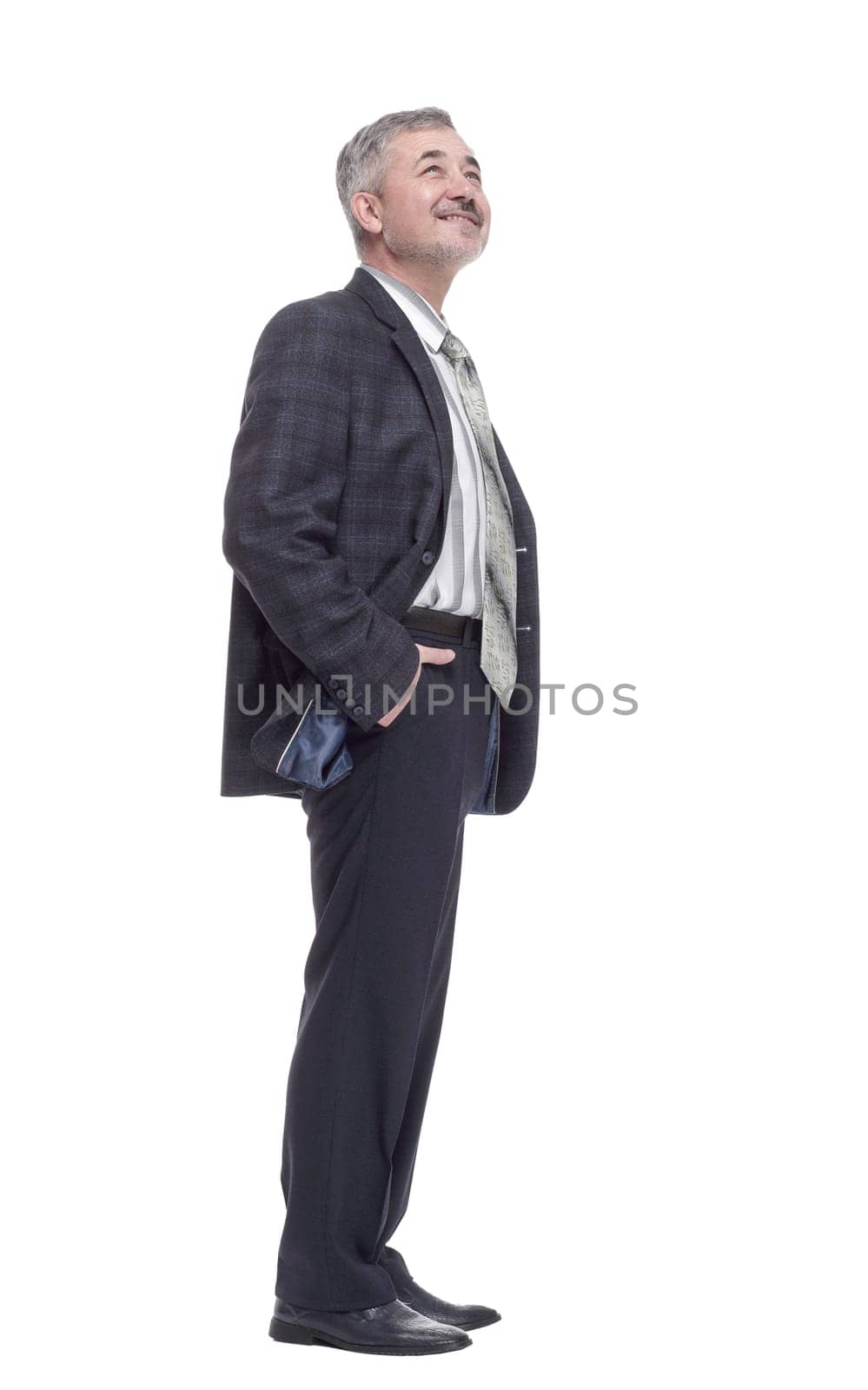 side view. glad mature man in casual clothes. isolated on a white background