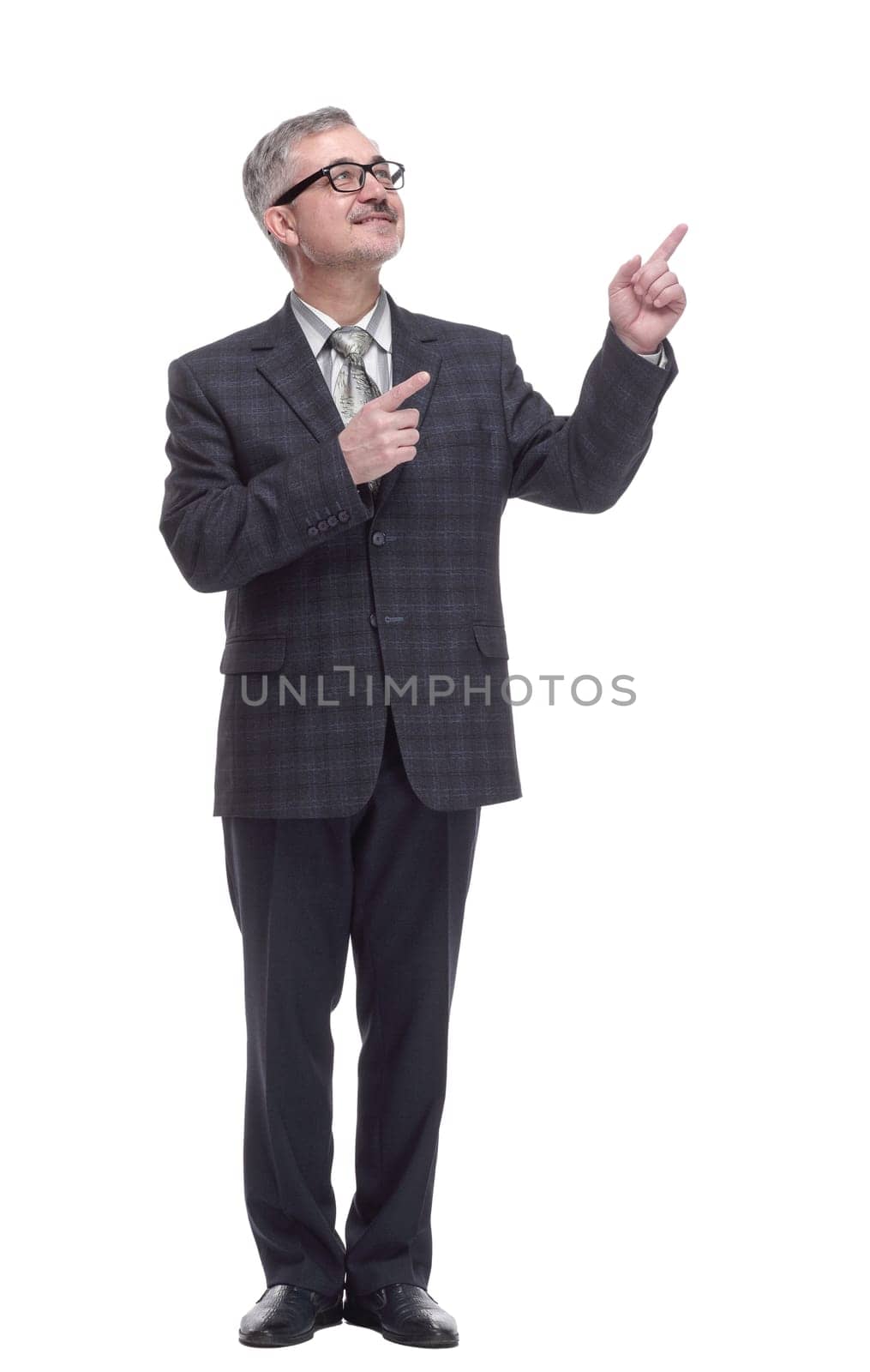 in full growth. smiling adult male pointing in the direction. isolated on a white background