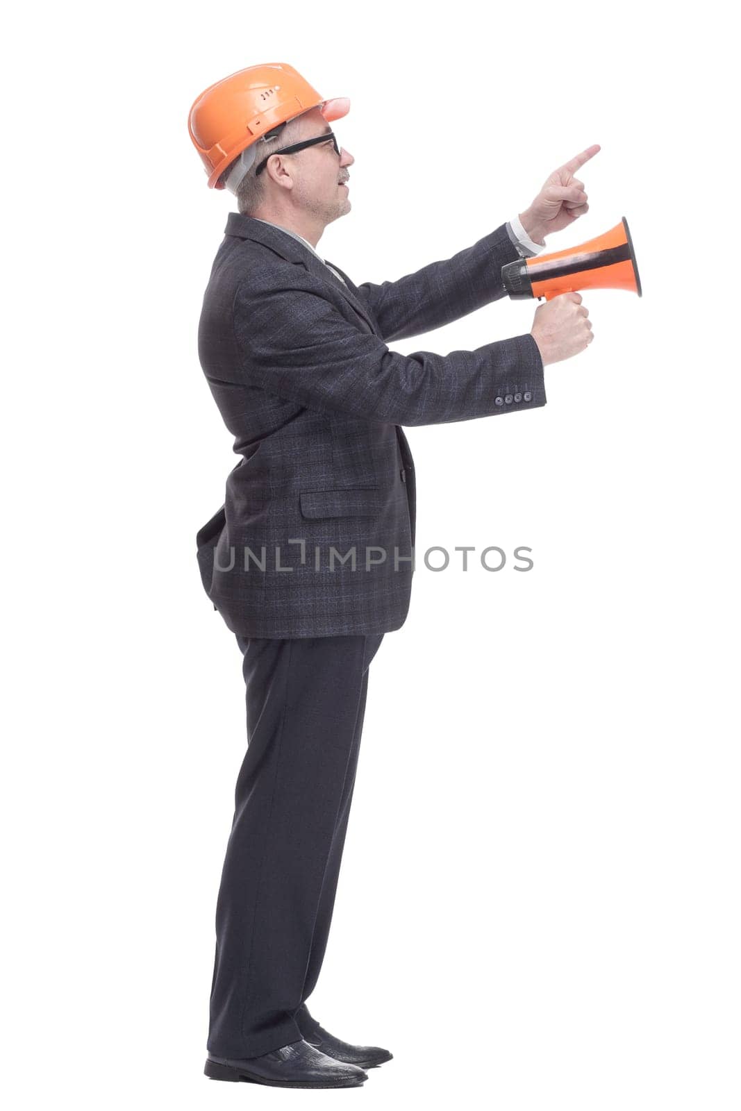 side view. an architect with a megaphone pointing to an ad on a white wall. isolated on a white