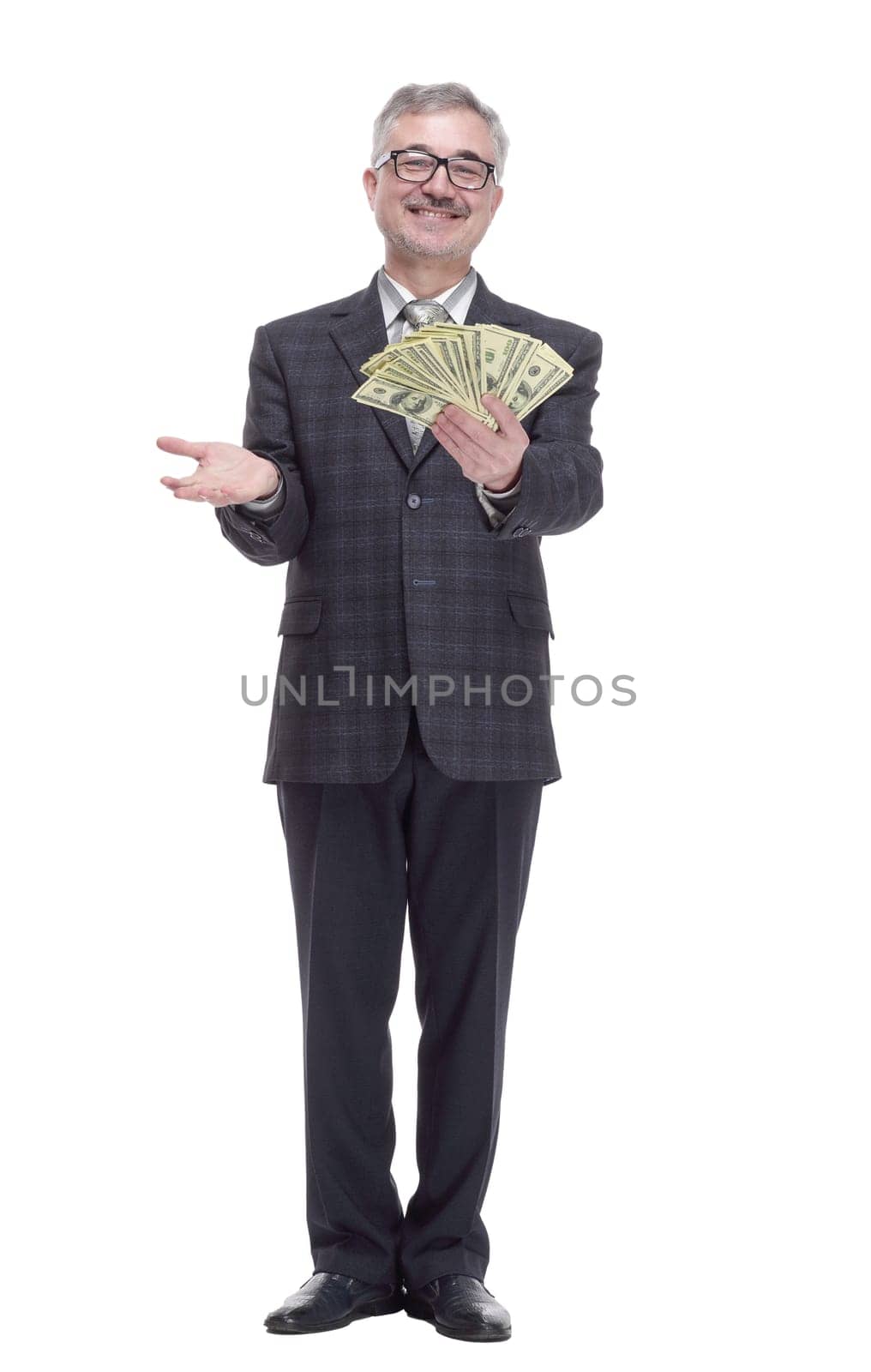 in full growth. happy man with cash bills showing thumbs up. isolated on a white