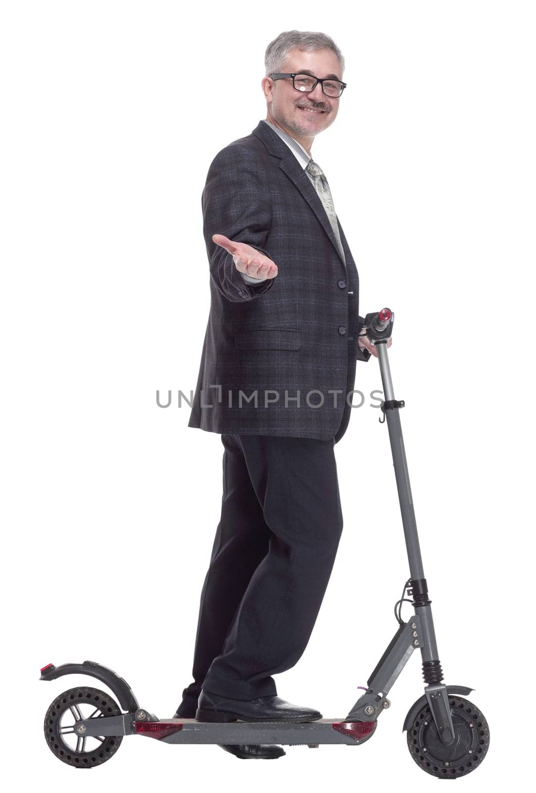 side view. friendly adult male with an electric scooter. isolated on a white background