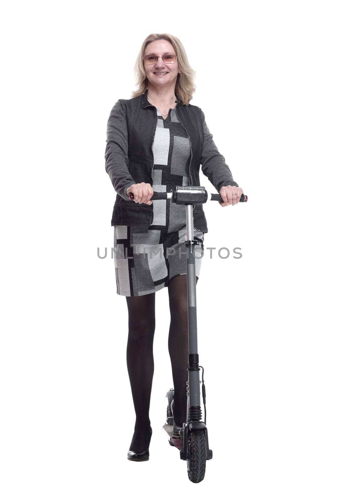 in full growth. a smiling young woman with an electric scooter. isolated on a white background