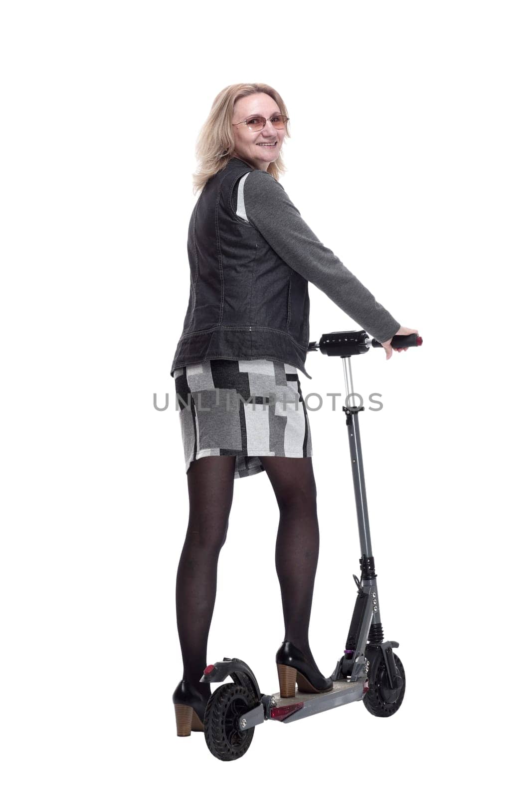 rear view. young woman with electric scooter looking back. isolated on a white background