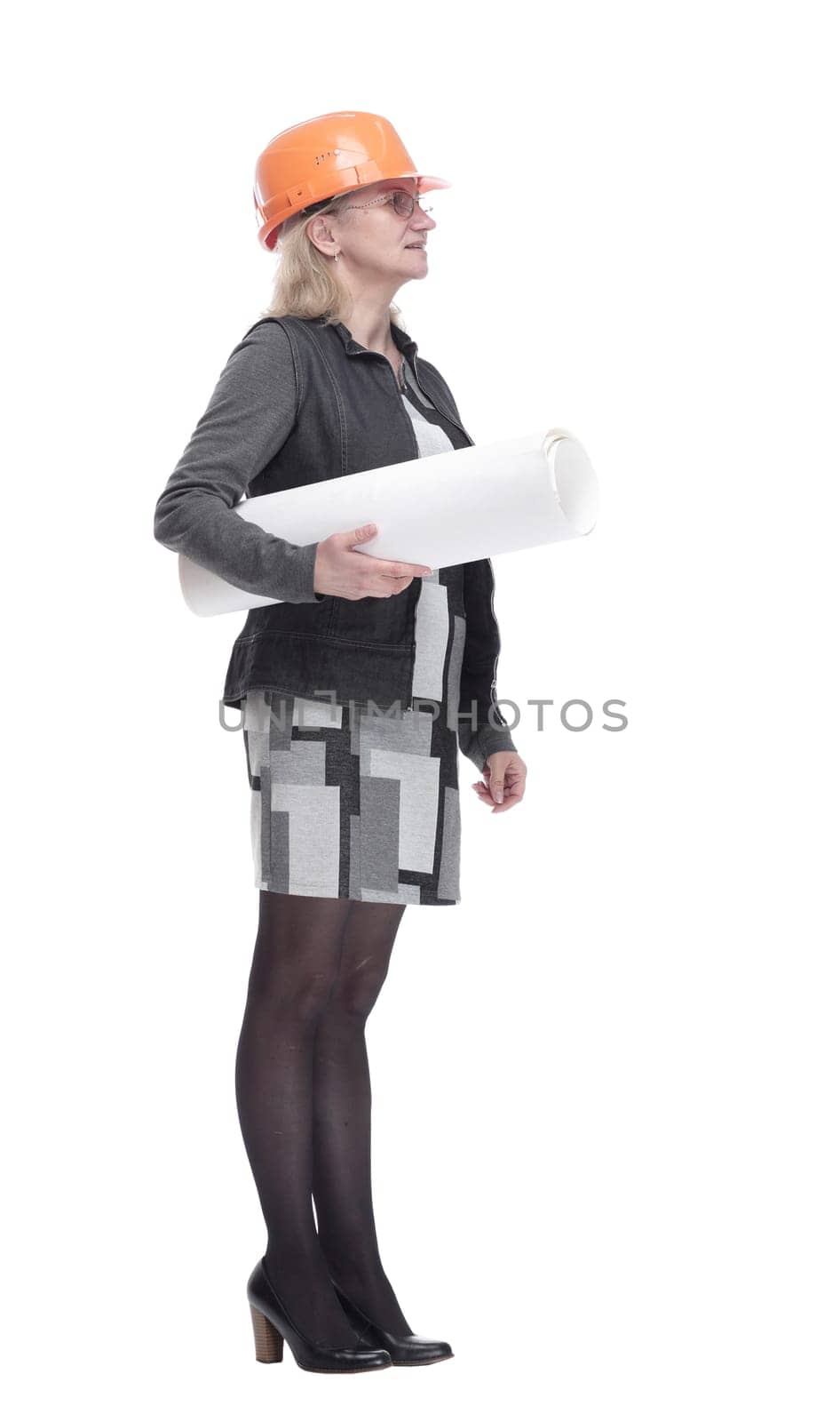 side view. female architect with drawings looking at a white screen. isolated on a white