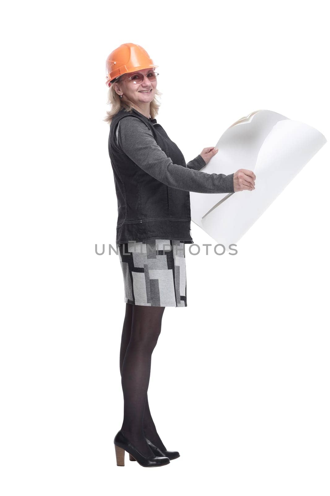 side view. woman architect with a drawing looking at you. isolated on a white background
