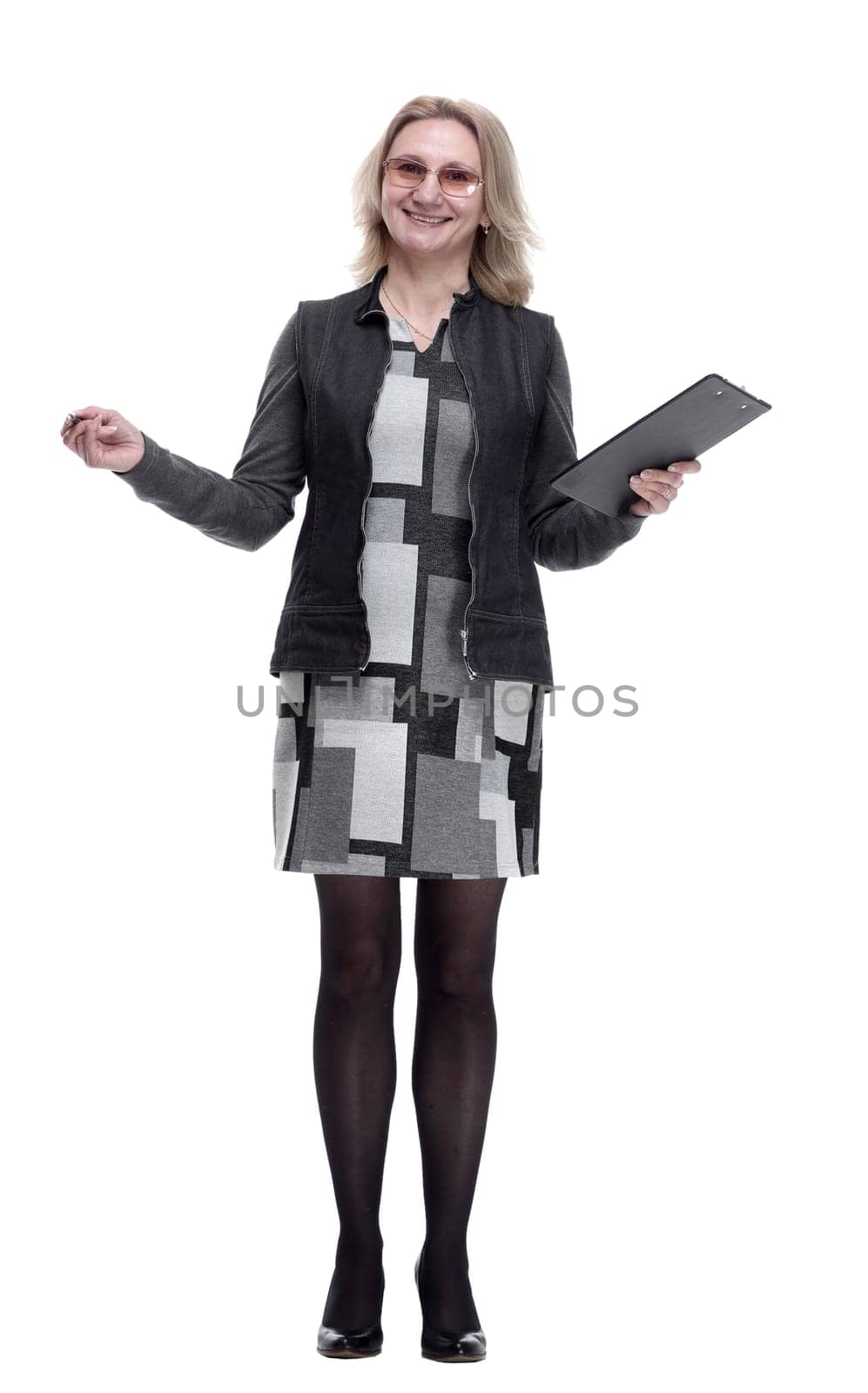 in full growth. attractive young woman taking notes in the clipboard .isolated on a white background