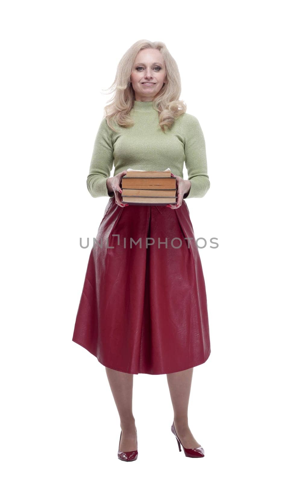 in full growth. an elegant woman with a stack of books . isolated on a white background