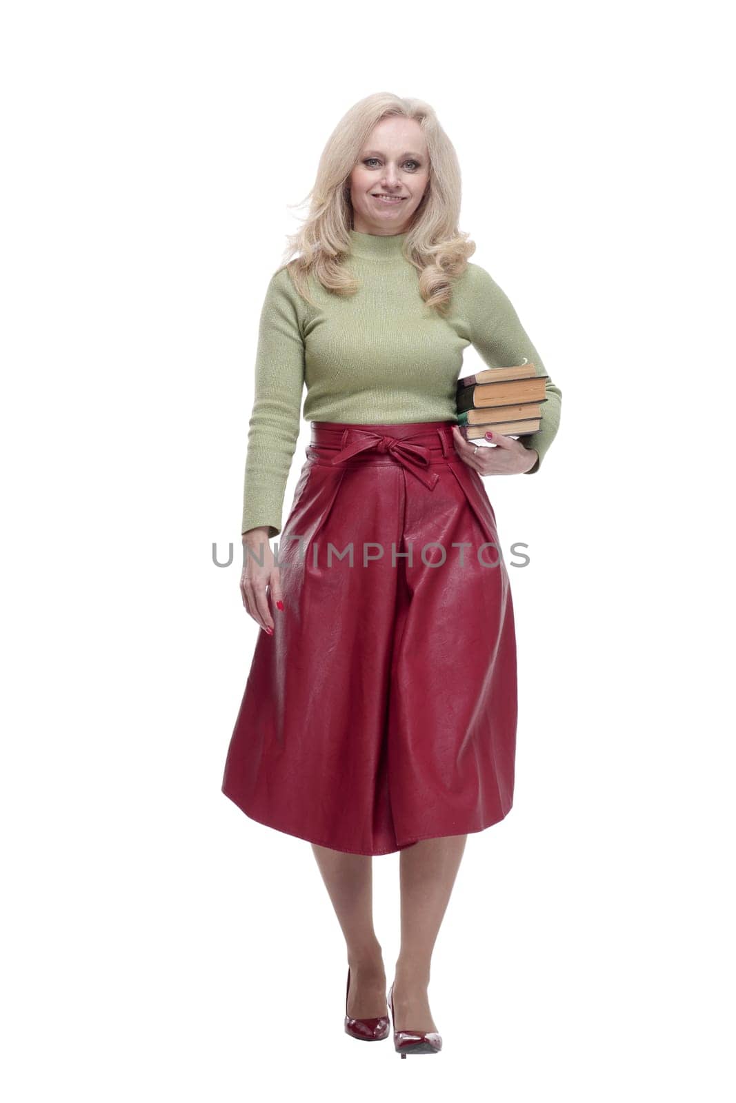in full growth. an elegant woman with a stack of books . isolated on a white background