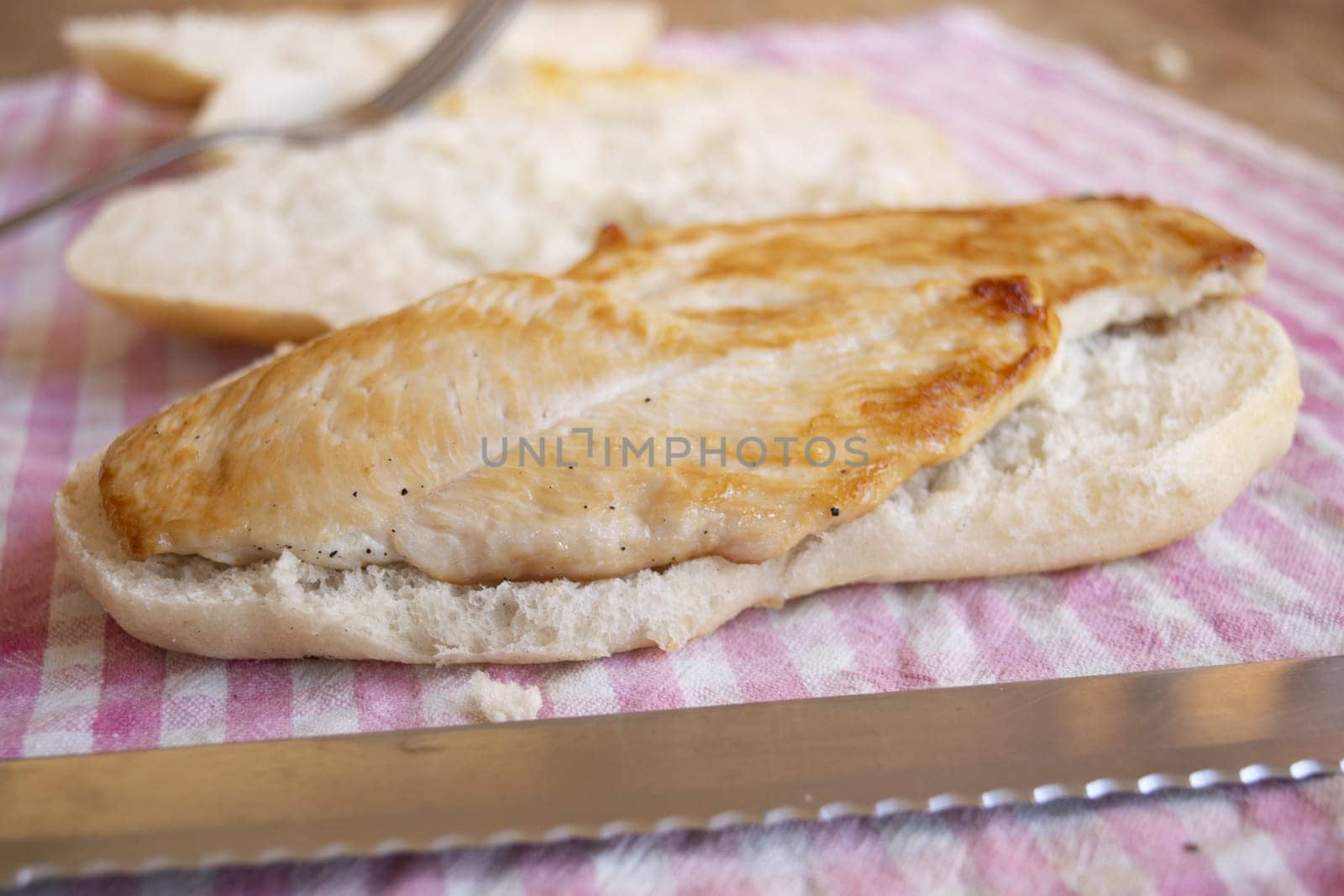 preparing a grilled chicken breast sandwich