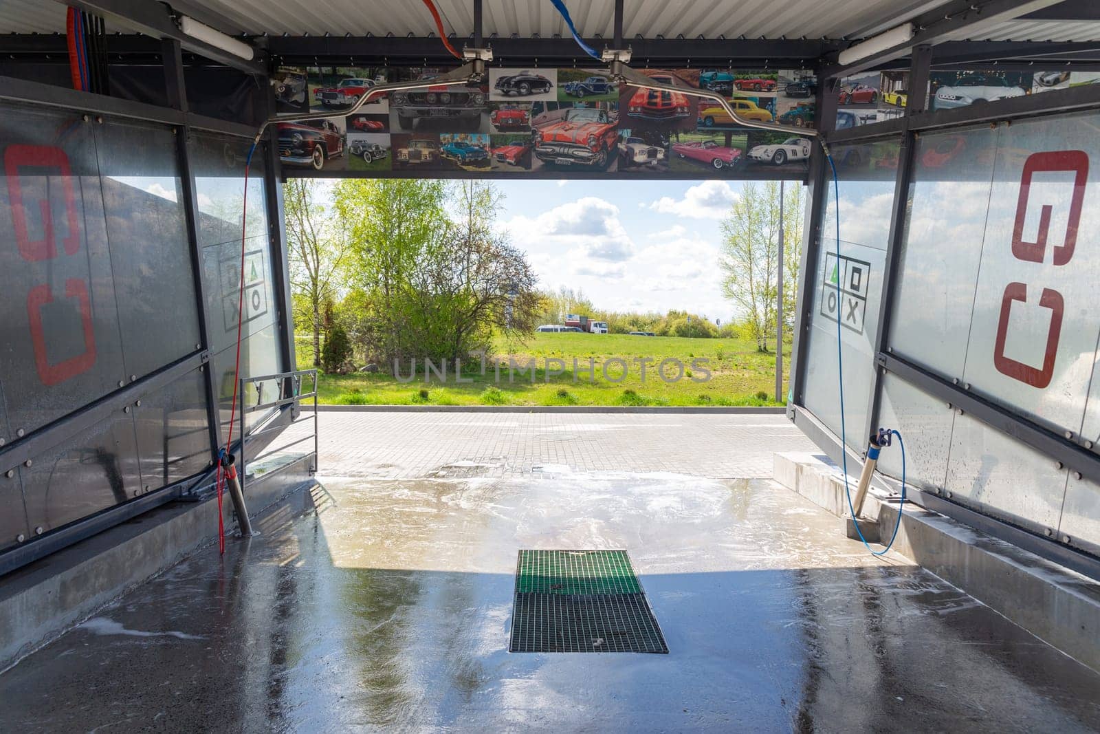 Grodno, Belarus - 28 April, 2023: The interior of the contactless self-service car wash Go on the Belusha str., originally designed in the style of game consoles and decorated with photos of rare cars.