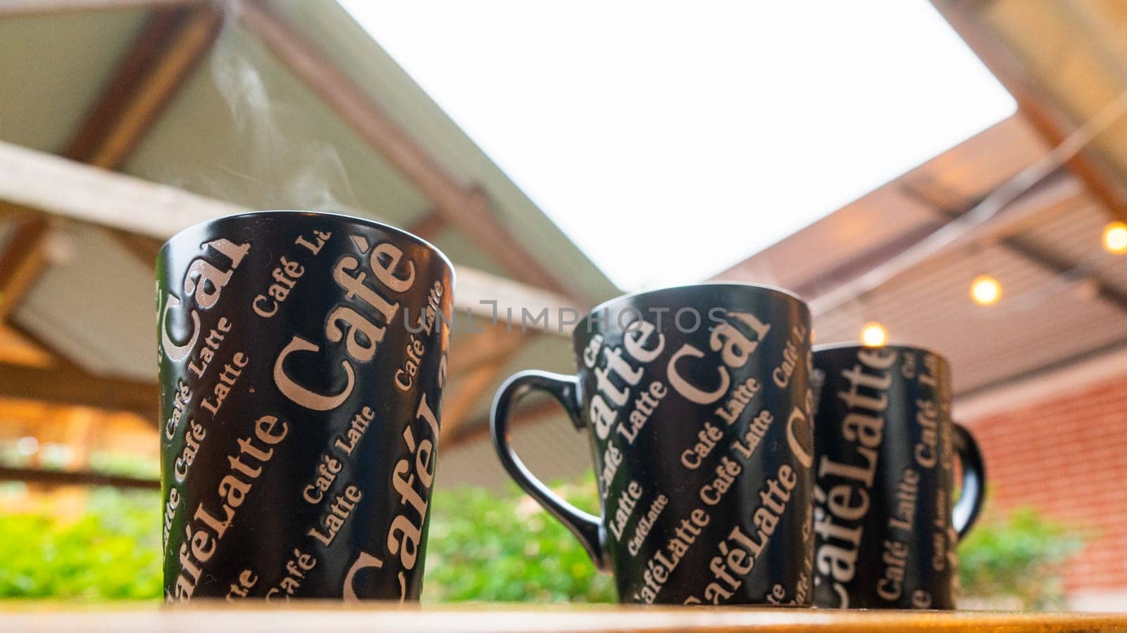 Cups of steaming coffee served at a bar of a breakfast restaurant in Nicaragua by cfalvarez