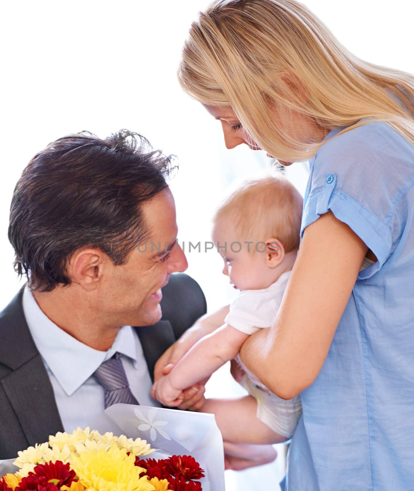 This is our favourite part of the day. Young mother and father adoring their cute baby together